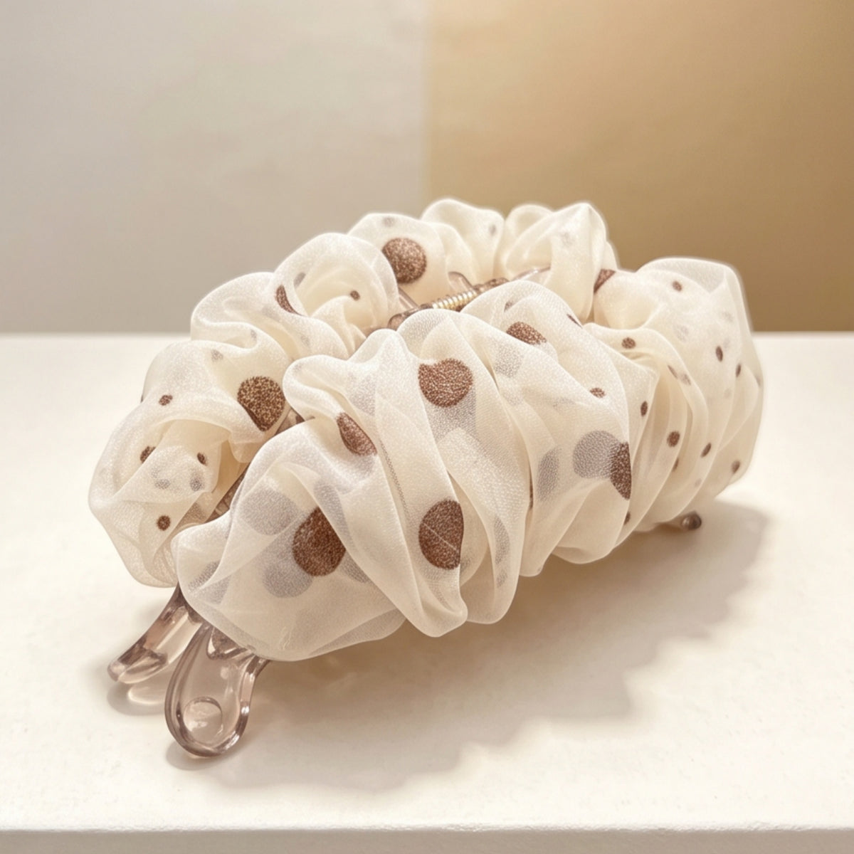 Bronze glitter polka-dot mesh banana hair clip, angled detail view