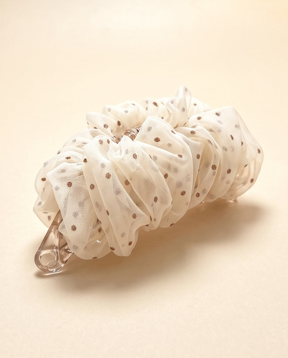 Brown polka-dot mesh banana hair clip angled view
