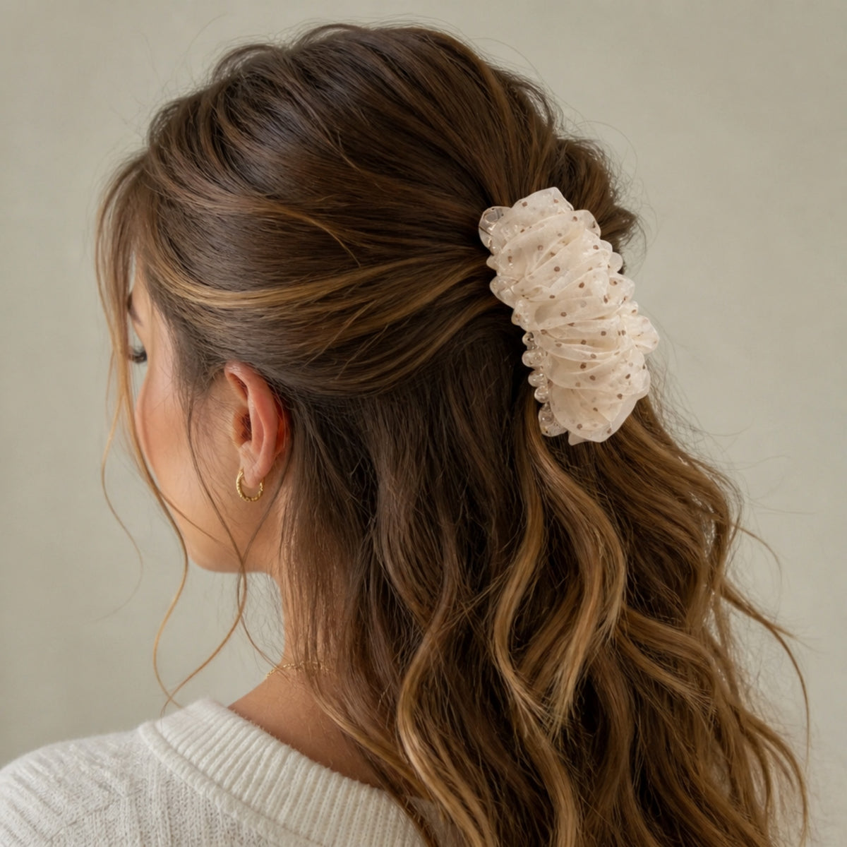 Brown polka-dot mesh banana hair clip worn in hair
