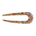 A vintage-style hair claw clip with a marbled green and brown resin body, decorated with a row of colorful rhinestones on the left side, shown on a plain white background.
