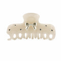 Ivory Metal Bow Black Rhinestone Acetate Claw Clip